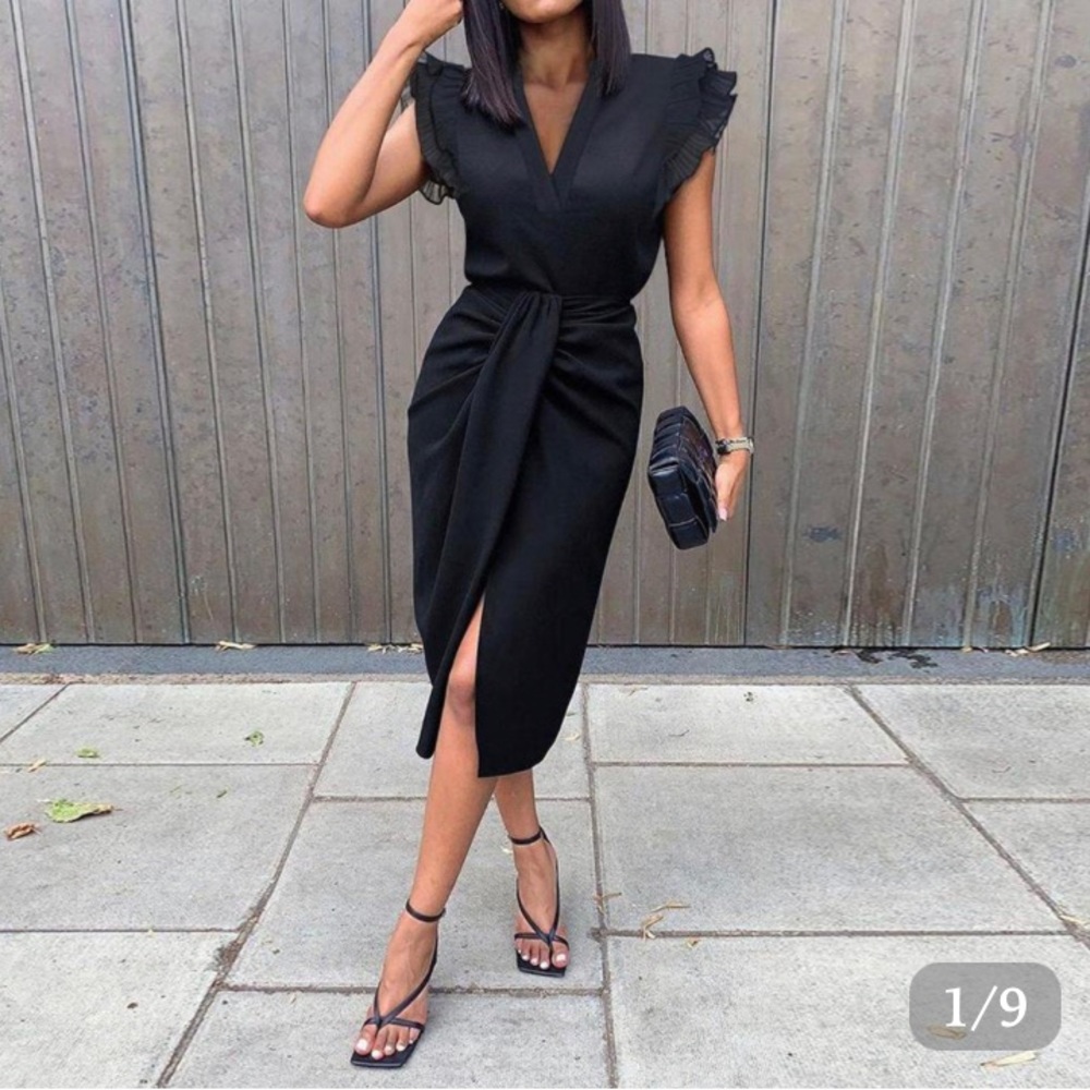 Black, double ruffle, sleeveless, plunging collar, high slit dress.